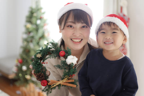 istock Parent and child with a handmade Christmas wreath 1455119071