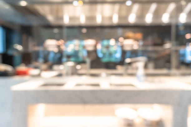 istock Open kitchen blur background in luxury hotel restaurant facility showing chef cooking over blurry food counter for buffet catering service 1455122123