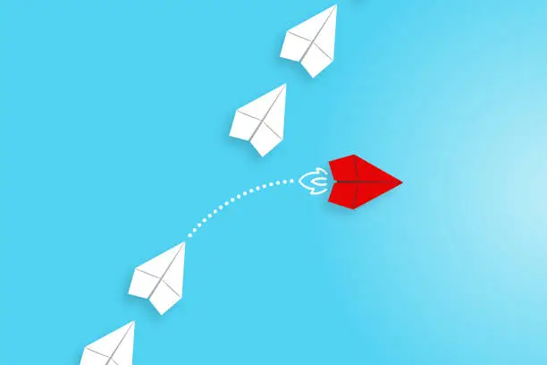 Vector illustration of Change concepts with red paper airplane leading among white