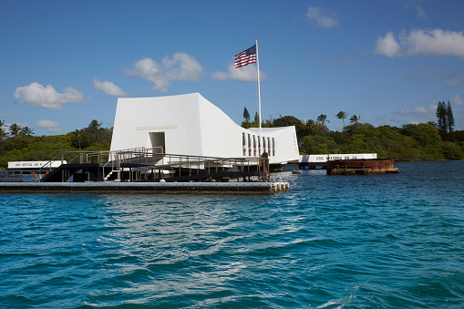 Pearl Harbor, Hawaii — 4/26/2013: The USS Arizona Memorial memorializes the location that the United States Pacific Fleet was attacked on December 7, 1941. This attack galvanized the United States entrance into World War II. Approximately 1,197 servicemen were lost in the attack.