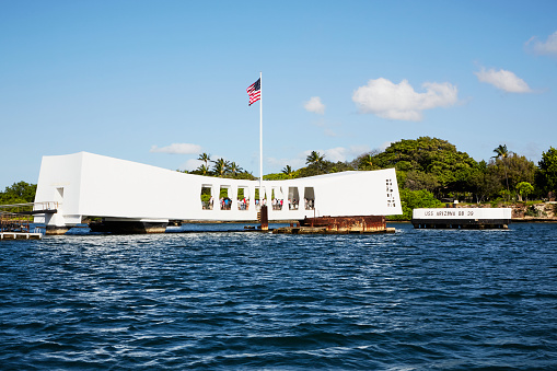 Pearl Harbor, Hawaii — 4/26/2013: The USS Arizona Memorial memorializes the location that the United States Pacific Fleet was attacked on December 7, 1941. This attack galvanized the United States entrance into World War II. Approximately 1,197 servicemen were lost in the attack.
