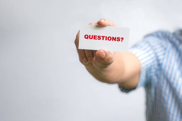 istock Questions?, word on white card. 1455135351