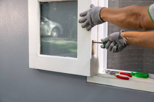 istock Construction worker repairing the window hinge after storm. 1455135829