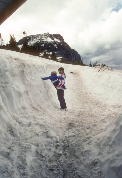 Glacier NP - Going to the Sun Road - Sampling Snow on Logan Pass - 1989 stock photo