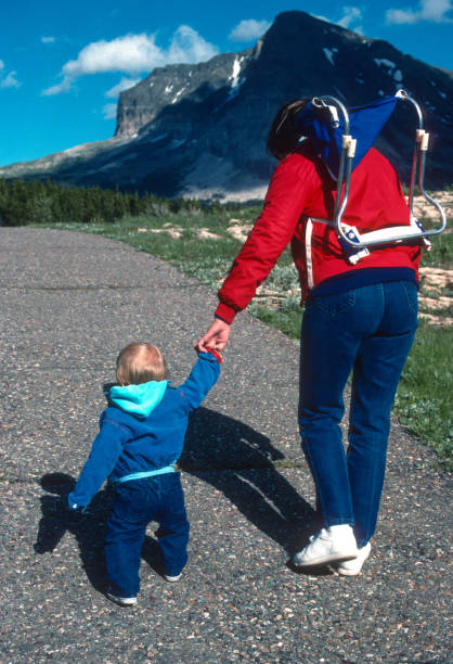 istock Glacier NP - Mother & Son on Trail at Many Glacier - 1989 1455144687