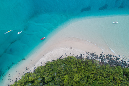 Aerial view of a beach with calm smooth waves