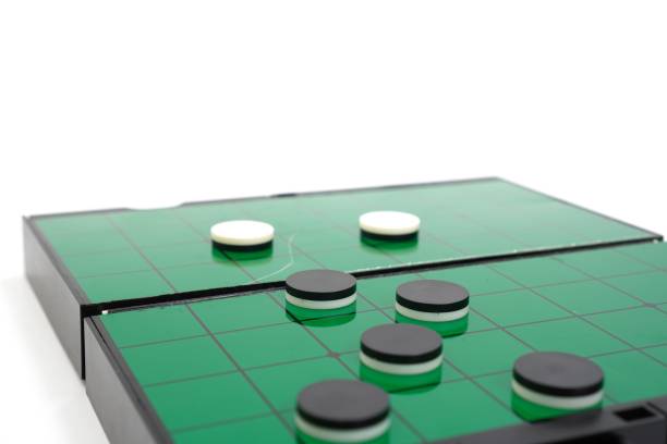 istock The picture shows a demonstration of checkers playing on a checkers board between white and black checkers, close up. 1455146861
