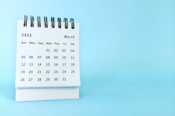 istock Selective focus of March 2023 desk calendar on blue background with copy space. 1455148619
