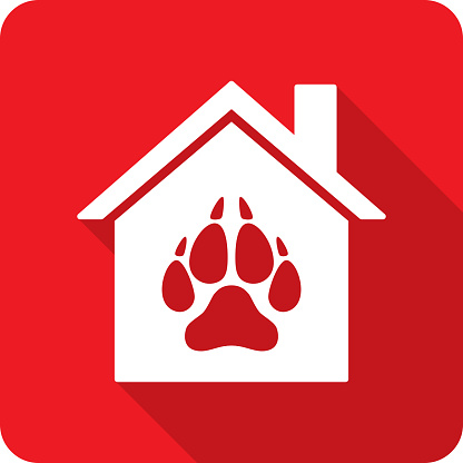 Vector illustration of a house with wolf paw print icon against a red background in flat style.