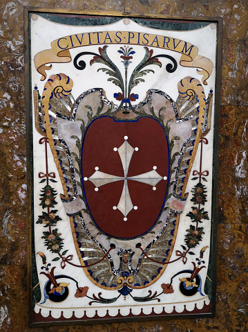 Emblem of the city of Pisa in the octagonal Cappella dei Principi at the Medici Chapels (Cappelle medicee) two structures at the Basilica of San Lorenzo, Florence, Italy, dating from the 16th and 17th centuries, with the purpose of celebrating the Medici family, patrons of the church and Grand Dukes of Tuscany.