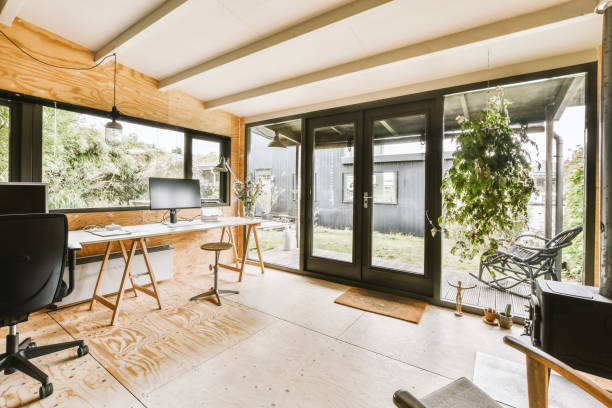 istock a home office with a desk and sliding glass doors 1455152176