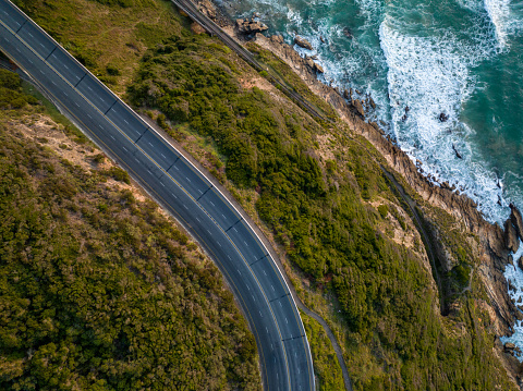 Top down shot of a scenic coastal road. The National Road winds along the scenic Garden Route in the Western Cape Province, South Africa.