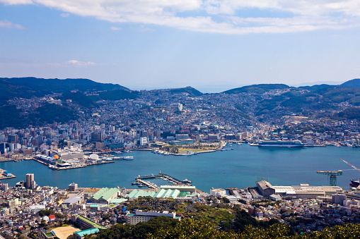 Nagasaki cityscapes skyline over the bay from above.