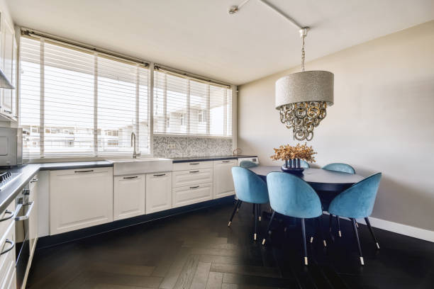 istock a kitchen with a table and chairs and a sink 1455154160