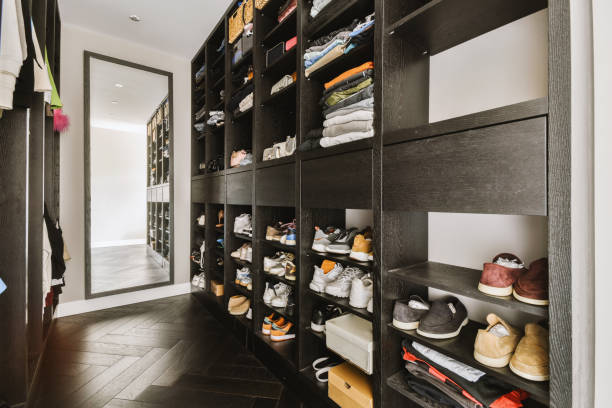 istock a walk in closet with shelves filled with shoes 1455154184