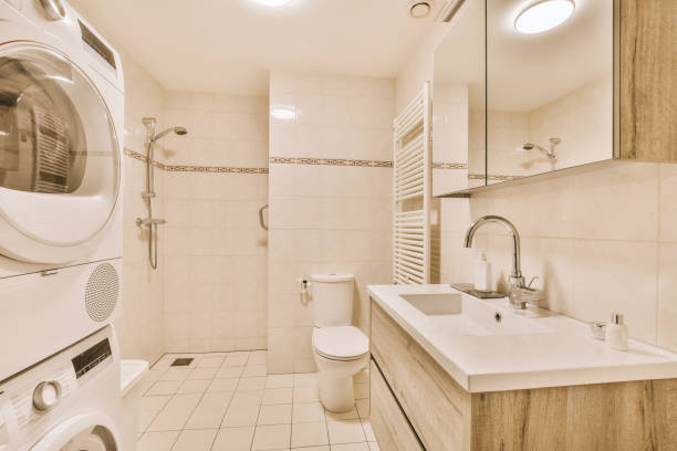istock a bathroom with a toilet sink and a washing machine 1455156088