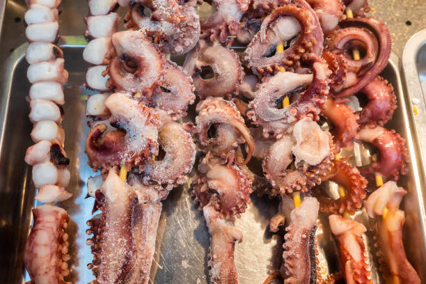 Fresh squid on skewers on a chinese market in Chengdu, Sichuan province, China