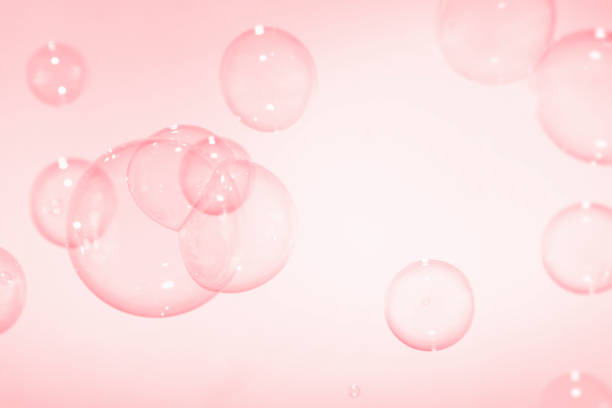 istock Abstract Transparent Pink Soap Bubbles Background. Freshness Soap Sud Bubbles Water. 1455157673