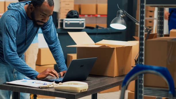 istock African american man putting products in cardboard boxes 1455159598