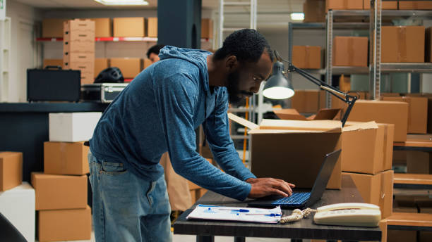 istock Startup partner arranging products in cardboard boxes 1455159689