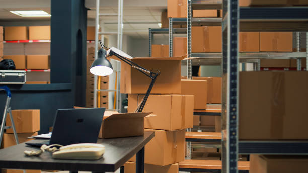 istock Empty storehouse with office desk to work on inventory and logistics 1455160458
