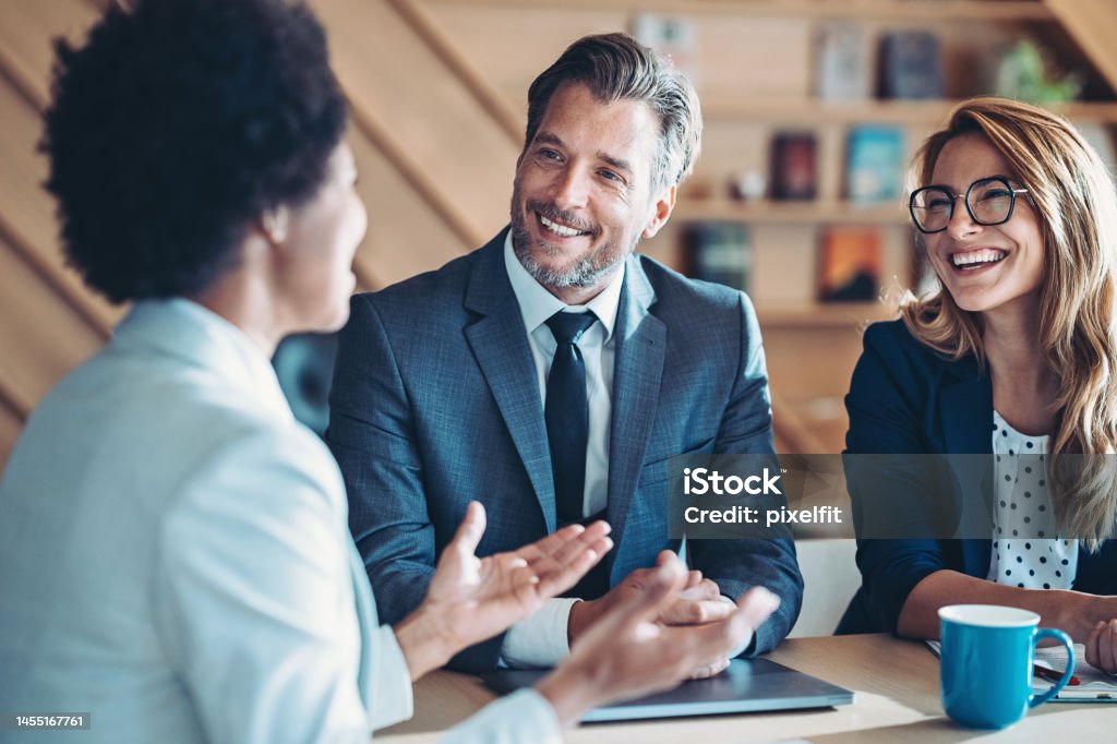 Growing the business together Business persons talking in the office Financial Advisor Stock Photo