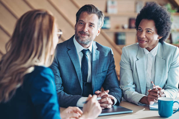 istock Company managers sitting side by side on a meeting 1455167769