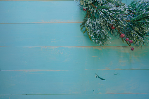 Snow and fir abstract Christmas blue wooden background