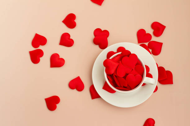 Affectionate image of red heart and coffee cup stock photo