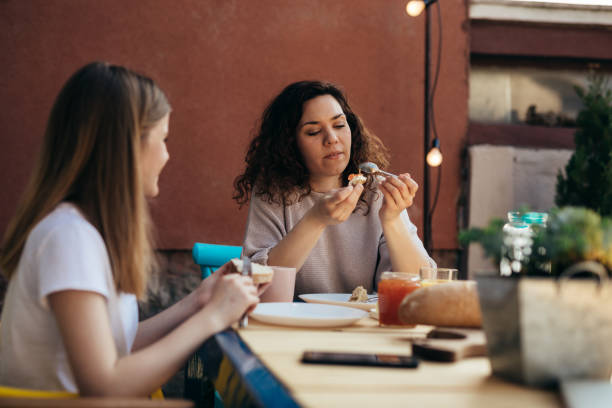 istock mother and daughter having breakfasta in home  backyard 1455177849