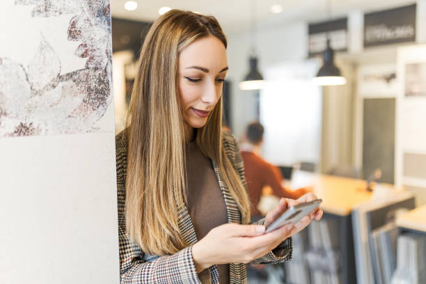 istock Happy businesswoman using smart phone 1455178029