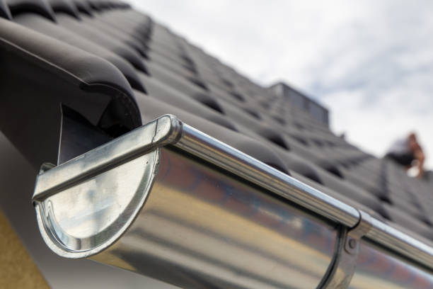 istock Roof gutter on a new tiled roof 1455179207