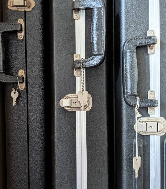 istock Hard cases of stringed instruments lined up in the room. 1455180029