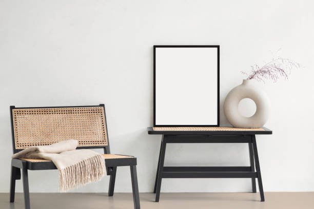 istock Artwork mockup in interior design. Blank picture frame on a wall. Vertical orientation 1455180248