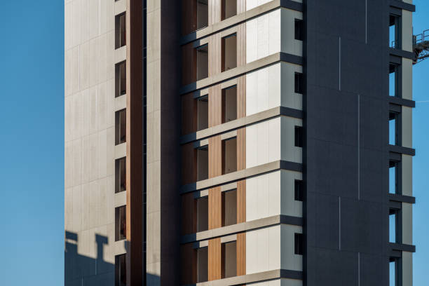 Newly built apartment construction with decorative coating on the facade