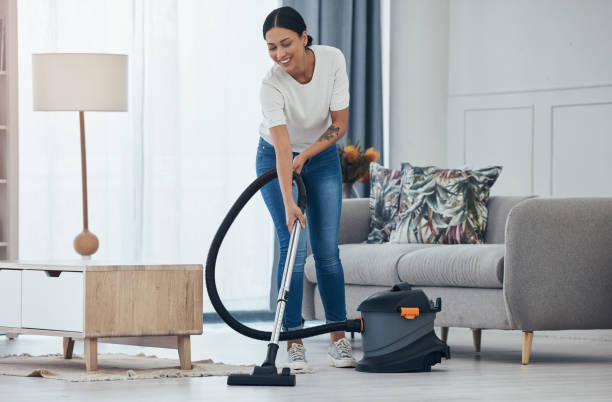 Black woman vacuum cleaner, smile in living room and cleaning tiles floor in home for hygiene. Woman cleaner, happy with appliance for housekeeping work on flooring in house for dust or dirt indoors aspiradora de mujer negra, sonrisa en la sala de estar y limpieza de baldosas del piso en el hogar para la higiene. mujer limpiadora, feliz con el electrodoméstico para el trabajo de limpieza en el piso en casa para el polvo o la suciedad en el interior