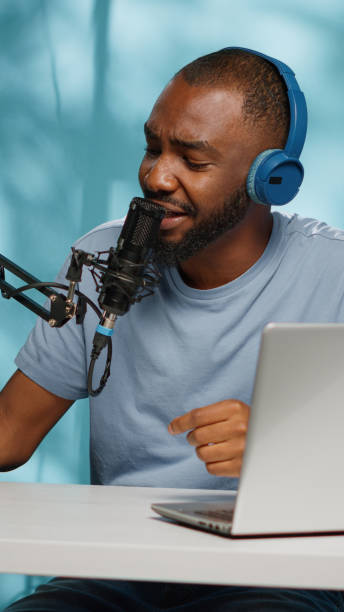 istock Influencer using podcast equipment and headphones 1455183936