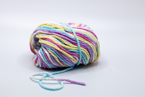 Image of knitting Ball of yarn on a wooden background. Winter accessory.