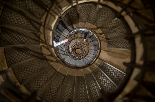 A spiral steel staircase of Triumphal Arch of the Star in Paris, France