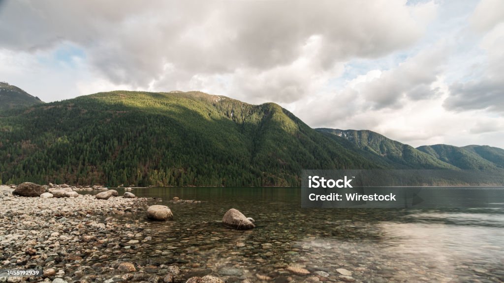 Wide Landscape of Alouette Lake, Golden Ears Provincial Park, British Columbia Peaceful and serene mountain and lake in Golden Ears Provincial Park, Maple Ridge, British Columbia. An image of mindfulness. Adventure Stock Photo