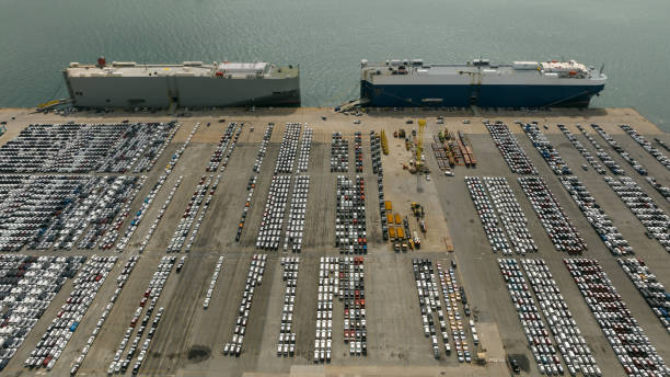 istock Large RoRo (Roll-on Roll-off) into Commercial dock loading new car product order for sale for export international on the sea, business service transportation concept 1455197711