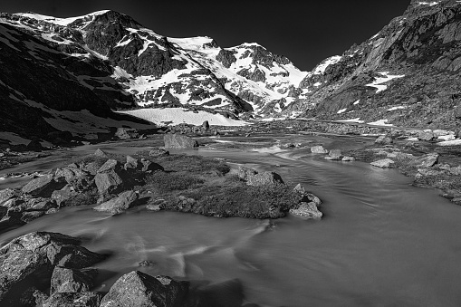 A beautiful sunny mountainscape in Switzerland in grayscale