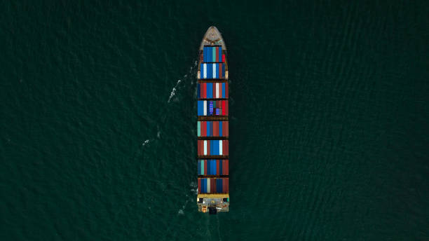 istock Container ship carrying container for import and export international in sea aerial top view photograph from drone 1455197730
