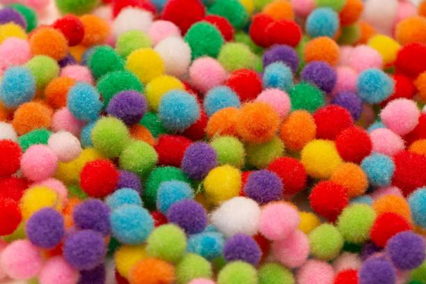 istock Rainbow colour fluffy balls filling background 1455197765