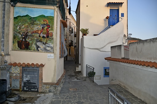 San Nicola arcella, Italy – August 08, 2020: A narrow street with painted murals in a village of Calabria region, Italy