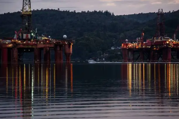 Photo of Semi-submersible drilling rigs Byford Dolphin .Oil drilling rigs, harbor at night