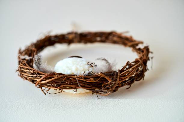 istock Closeup of a wreath made from branches on the white surface 1455199980