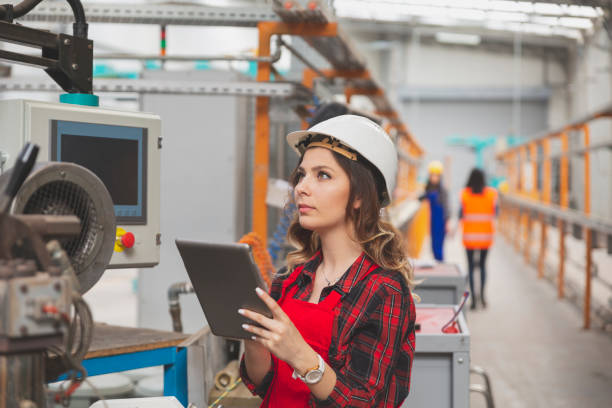 istock Young female maintenance engineer working with digital tablet 1455200336