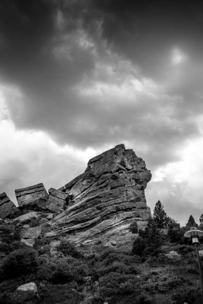 istock Grayscale shot of rock formations against cloudy sky 1455200575