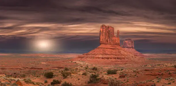 A scenery of Monument Valley red-sand desert region on the Arizona-Utah border in the USA